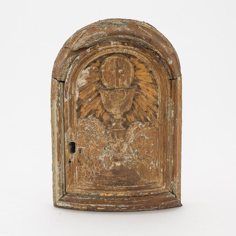 A carved and giltwood door to a church tabernacle, 18th/19th Century.
