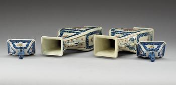 A pair of famille rose vases with covers, Qing dynasty, Qianlong (1736-95).