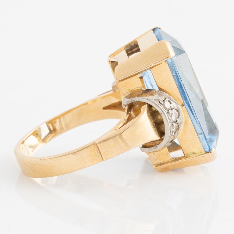 Ring in 18K gold with a synthetic blue stone and single-cut diamonds.