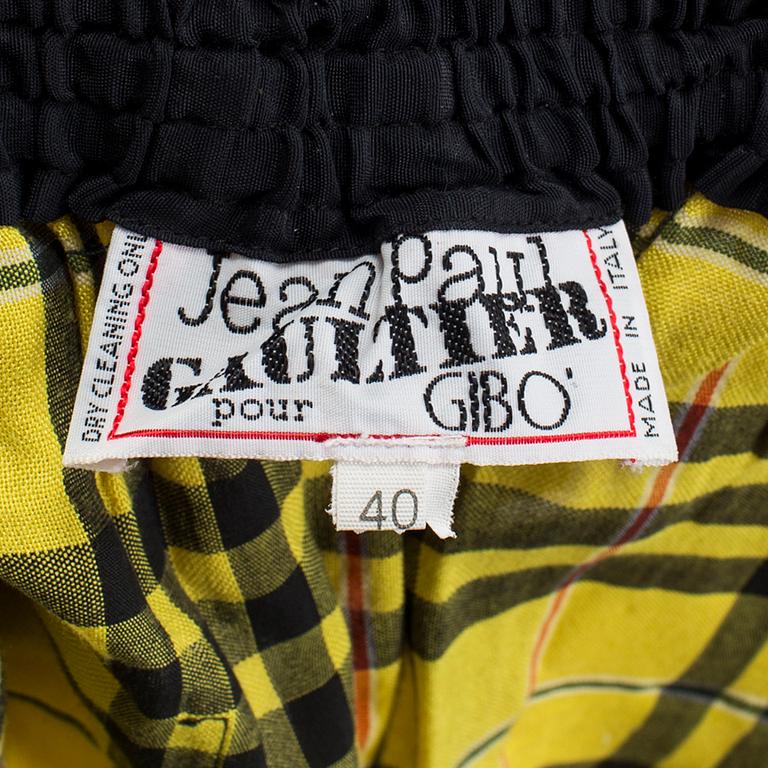 A checkered skirtby Jean Paul Gaultier.