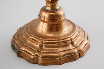 A pair of late barouqe bronze candlesticks, 18th century.