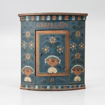 A folk art corner cabinet from Delsbo, Hälsingland dated 1847.