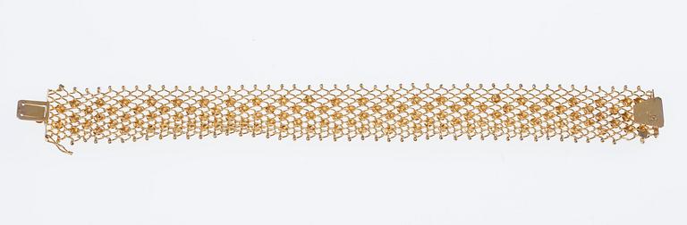 ARMSMYCKE, 18K guld. 1900-talets senare hälft. Vikt 19,3 g.