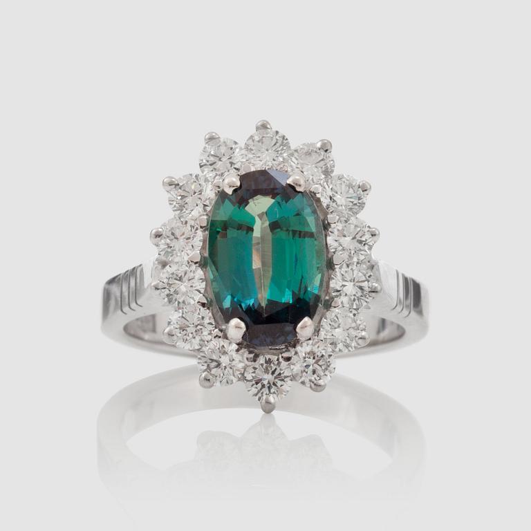 A alexandrite, 2.44 cts, and diamond ring. Surrounded by 14 brilliant-cut diamonds, 1.12 cts in total.