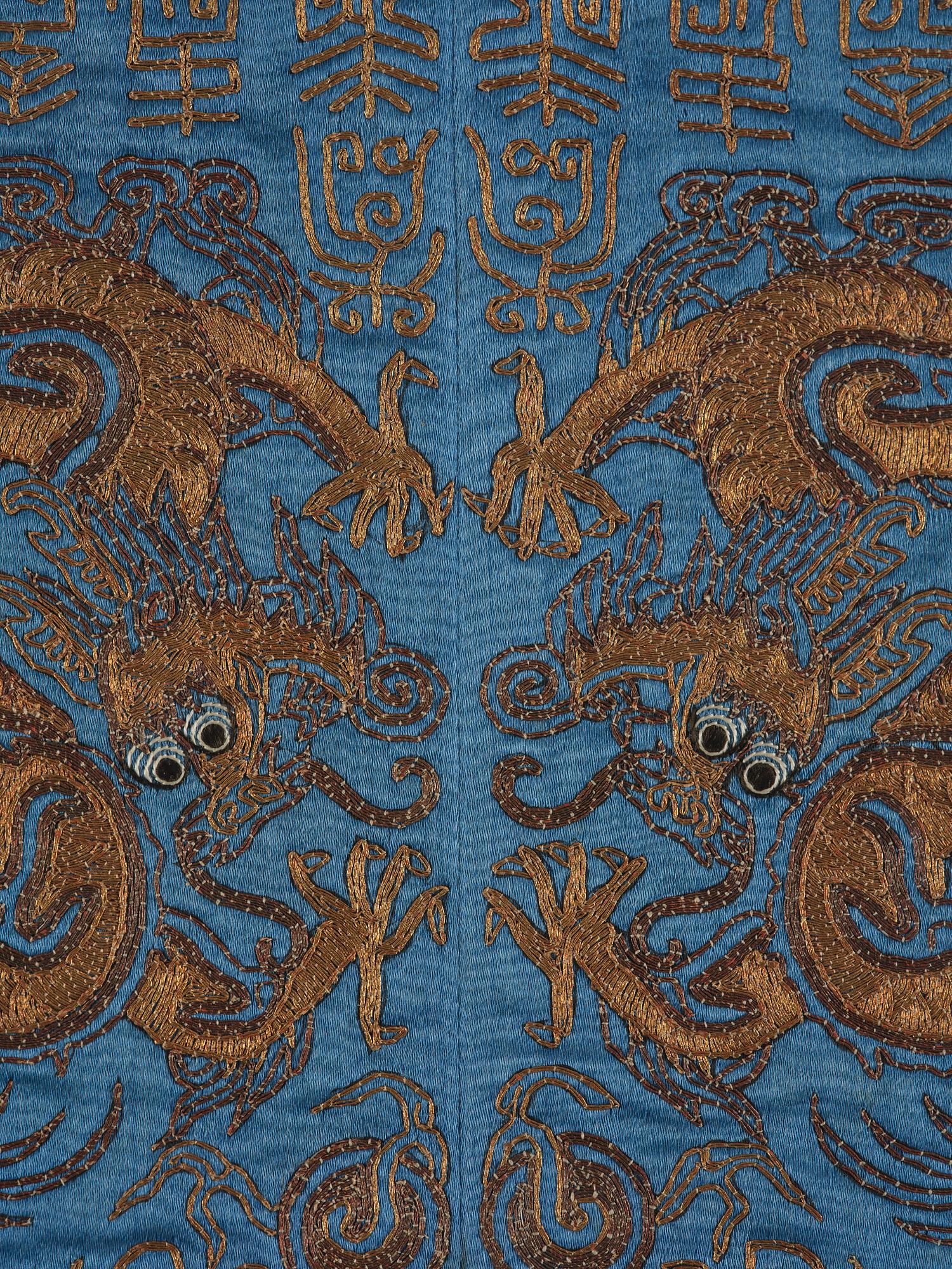 A silk emboridery of dragons, phoenix and shou characters, Qing dynasty, 19th century.