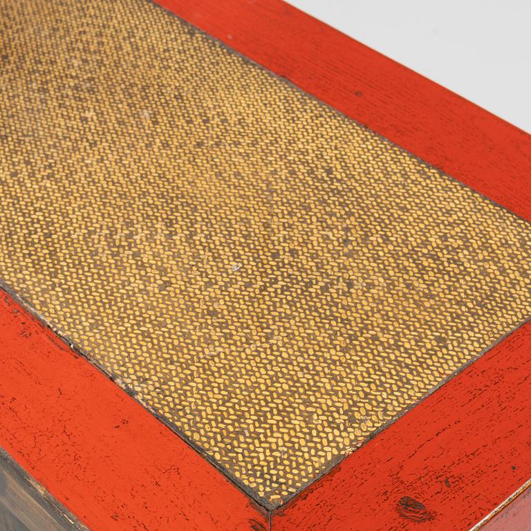 A Chinese red lacquered cabinet, 20th century.
