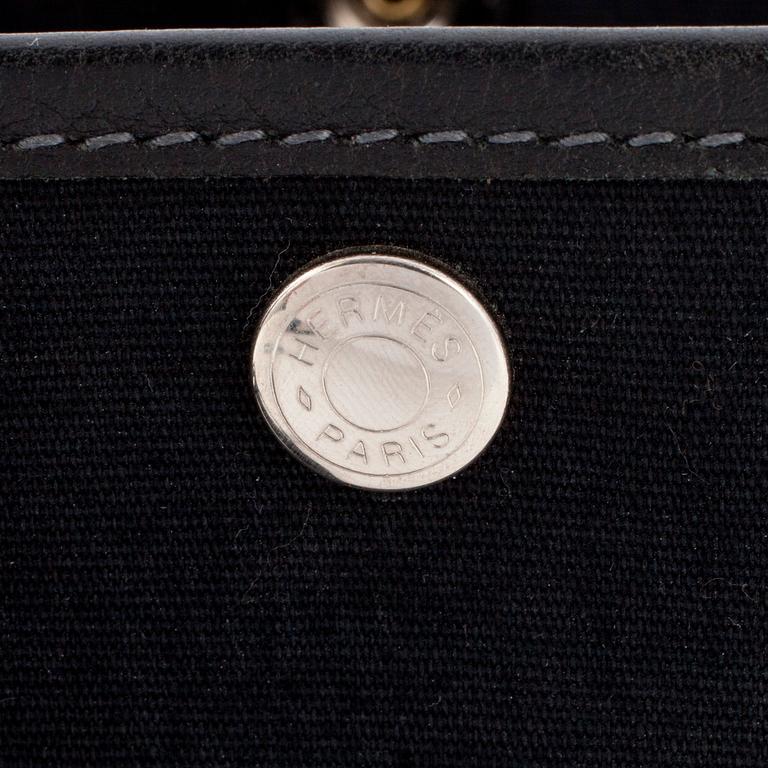 HERMÈS, a black canvas and leather bag, "Garden Party".