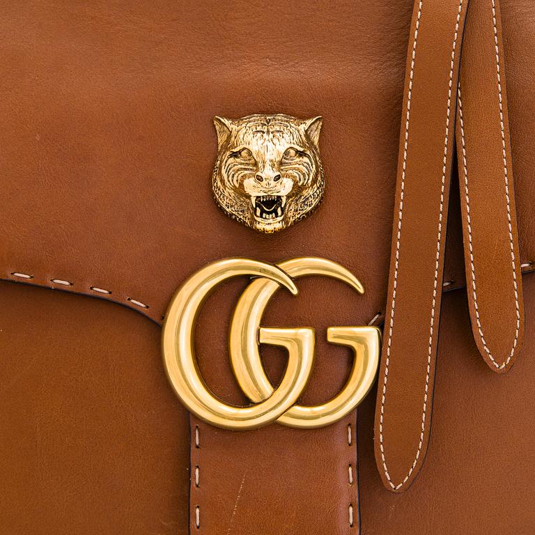 Gucci, a 'GG Marmont' leather bag.
