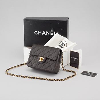 A Chanel "Mini Flap" purse.