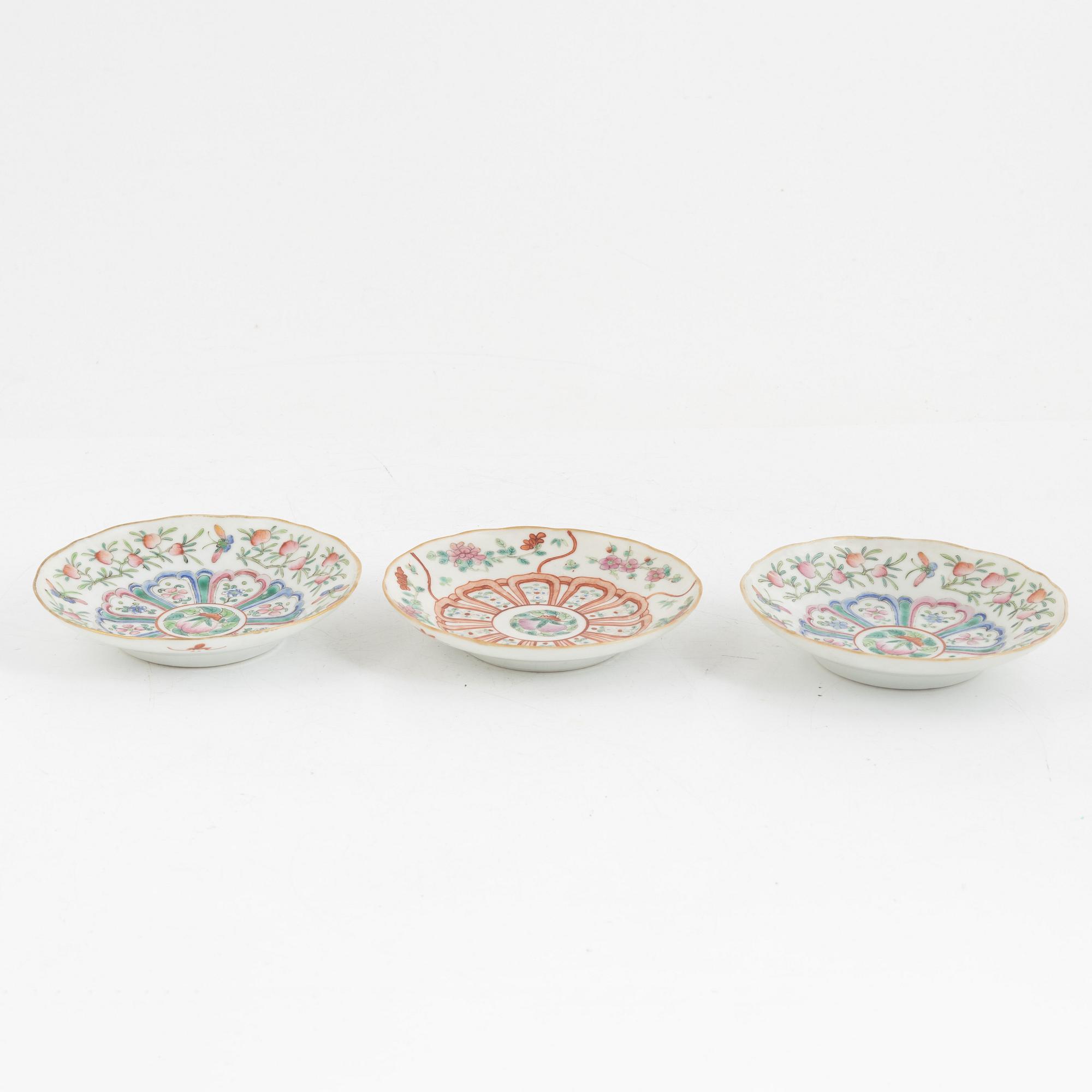 A pair of Chinese famille rose porcelain covers, and three saucers, late Qing dynasty, 19th century.