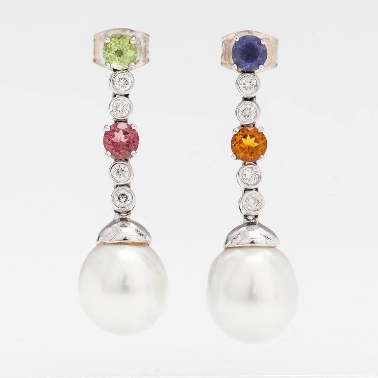 A pair of 18K white gold earrings with diamonds, tourmaline, peridote, citrine, cordierite and tahiti pearls.