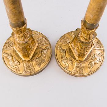 A PAIR OF CANDLESTICKS, gilt brass, early 19th Century.