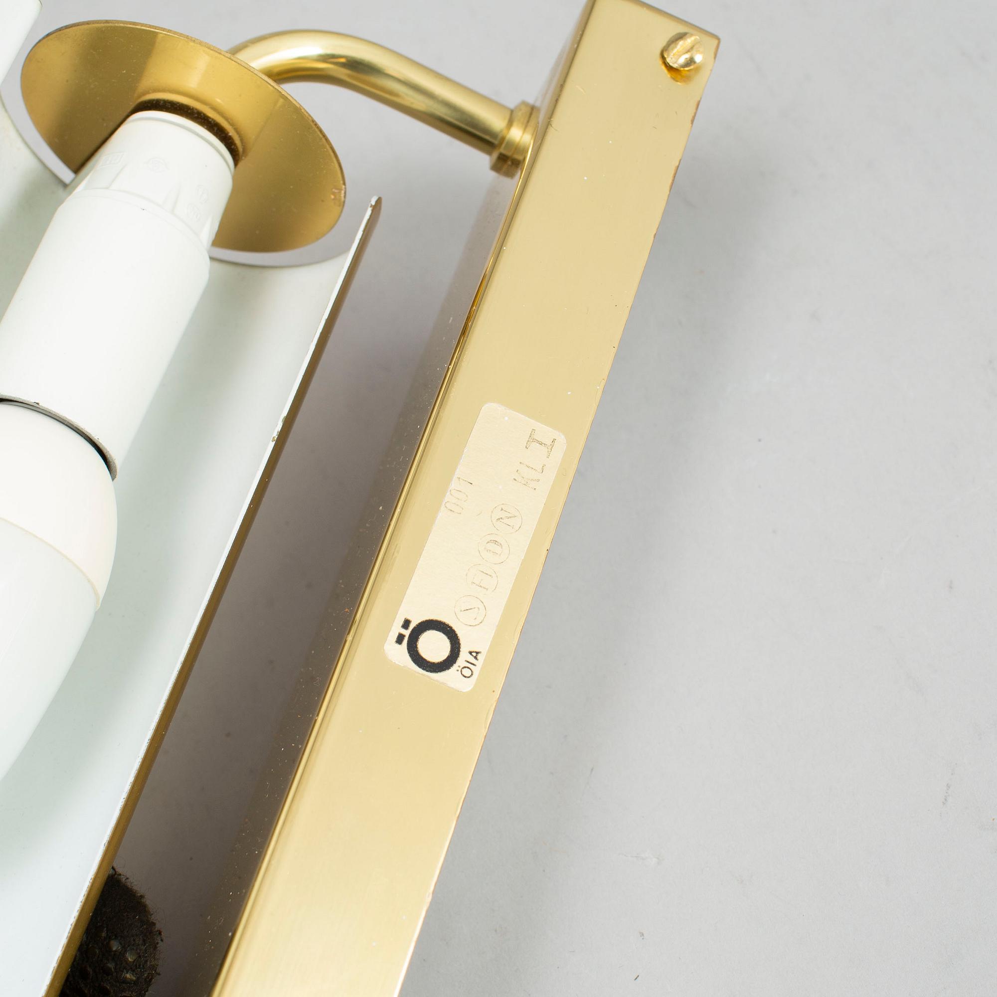 A PAIR OF BRASS WALL LAMPS FROM ÖIA.