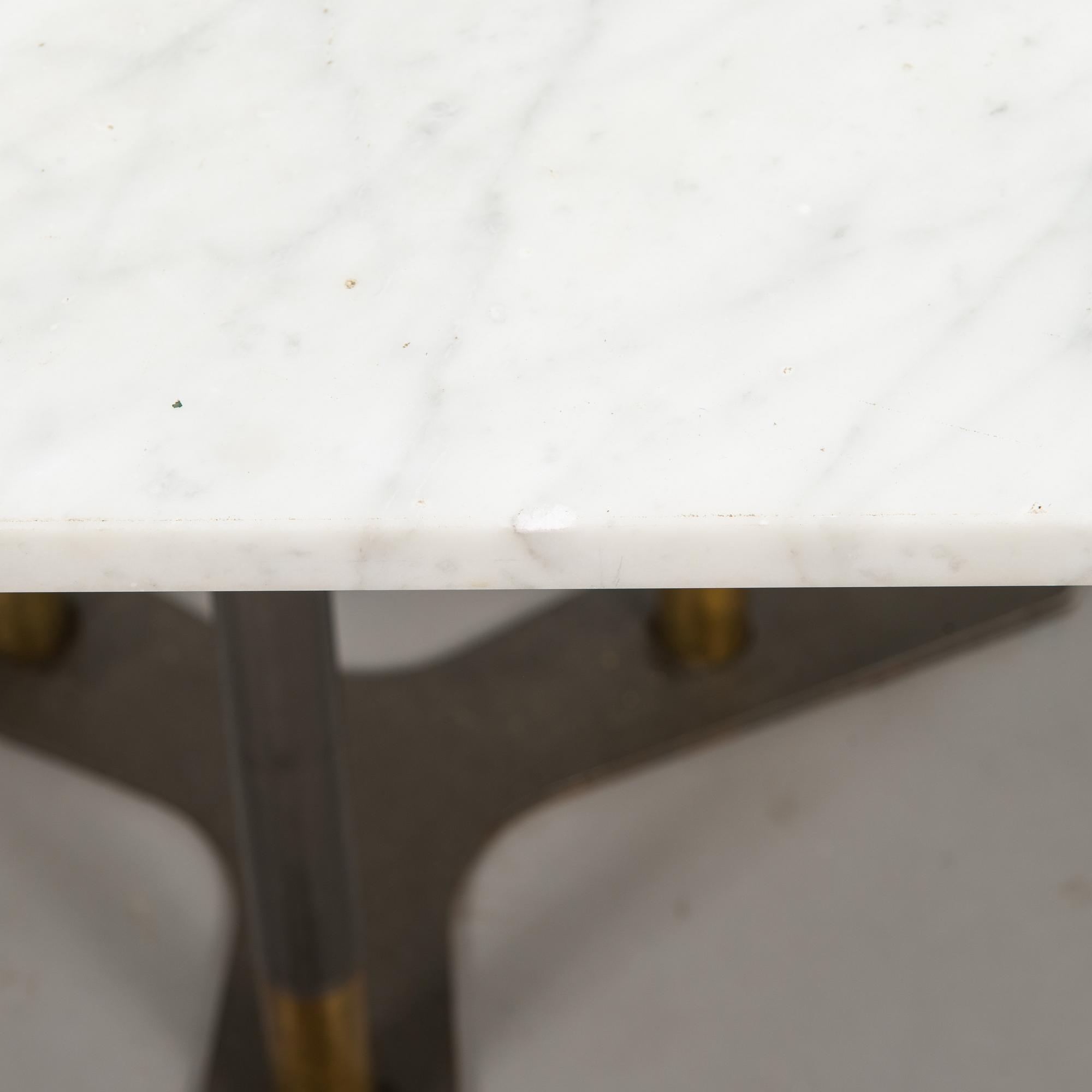 A marble top table, 21th century.