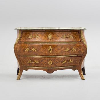 A 1700s rococo commode.