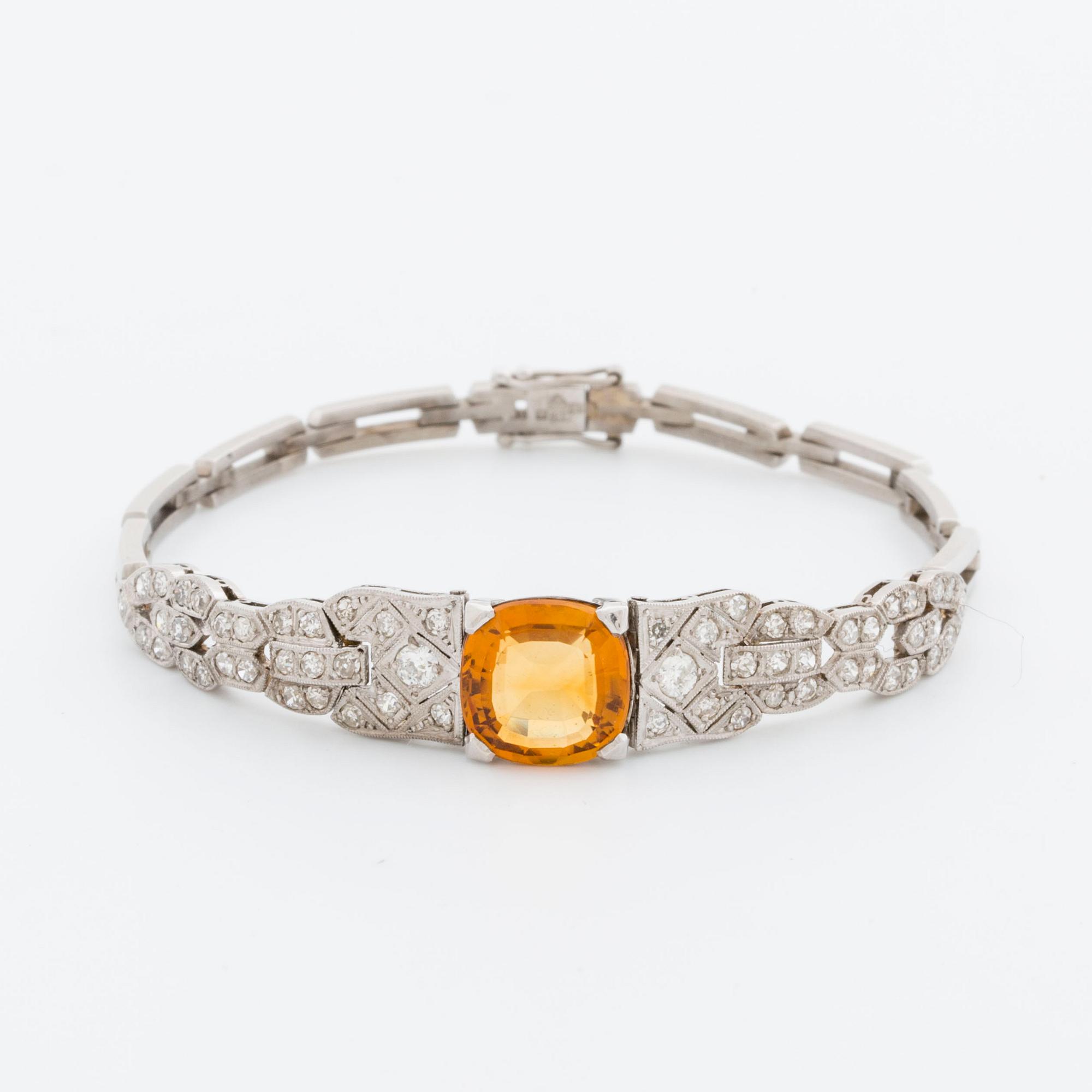 BRACELET platinum and 18K whitegold, 1 citrine, 2 old-cut and 8/8-cut diamonds approx 0,80 ct, G  Dahlgren & Co Malmö.
