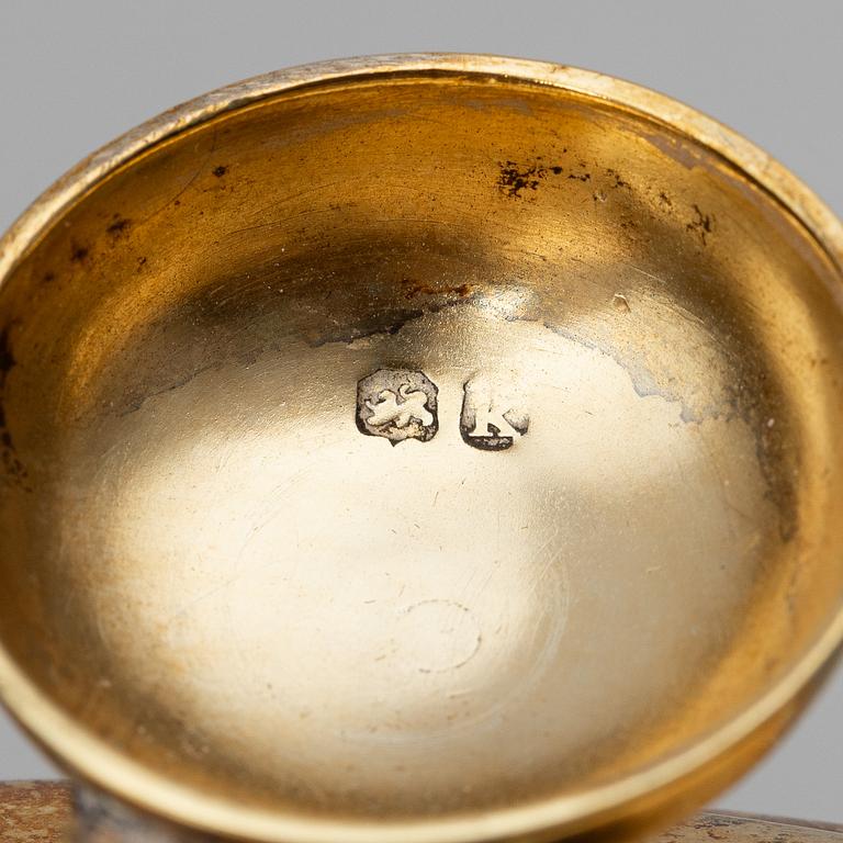 An English silver-gilt teapot with stand and burner, mark of Richard Sibley I, London 1825.