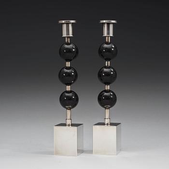 A pair of Sigurd Persson silver plated and porphyry candlesticks, Sweden.