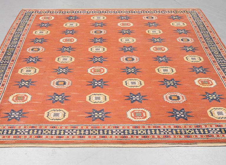 Märta Måås-Fjetterström, a carpet, "Röd Flossa", knotted pile, ca 300 x 272 cm, signed AB MMF.