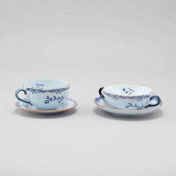 Seven "Ostindia" broth cups with sausers and chocolate cups with sausers in earthenware, Rörstrand, 20th century.