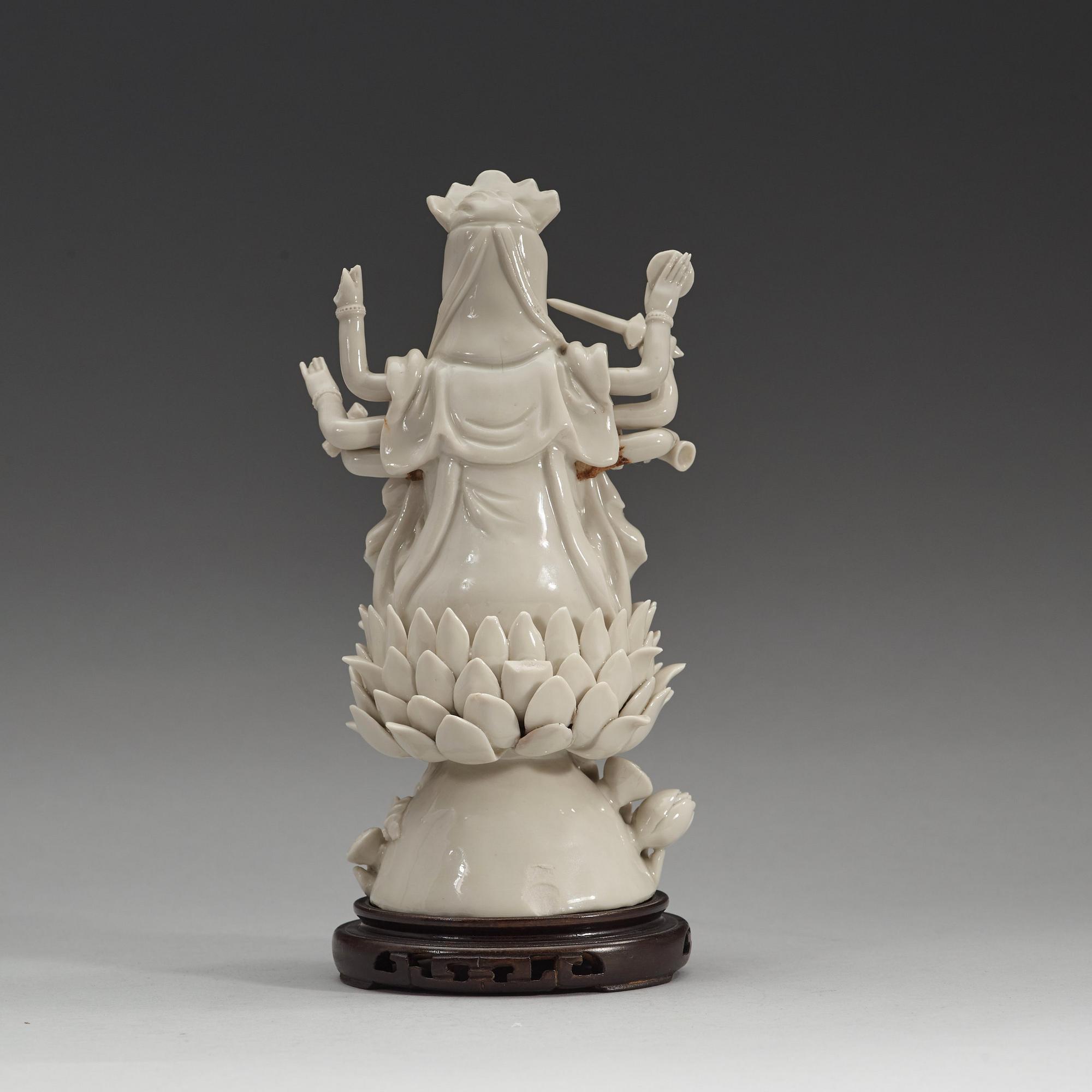 An eigth armed blanc de chine figure of a Bodhisattva, Qing dynasty, 19th Century.
