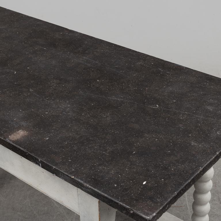 A 19/20th century stone top baroquestyle table.