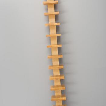 JOHN KANDELL, a "pilaster" wall shelf from the late 1900's.