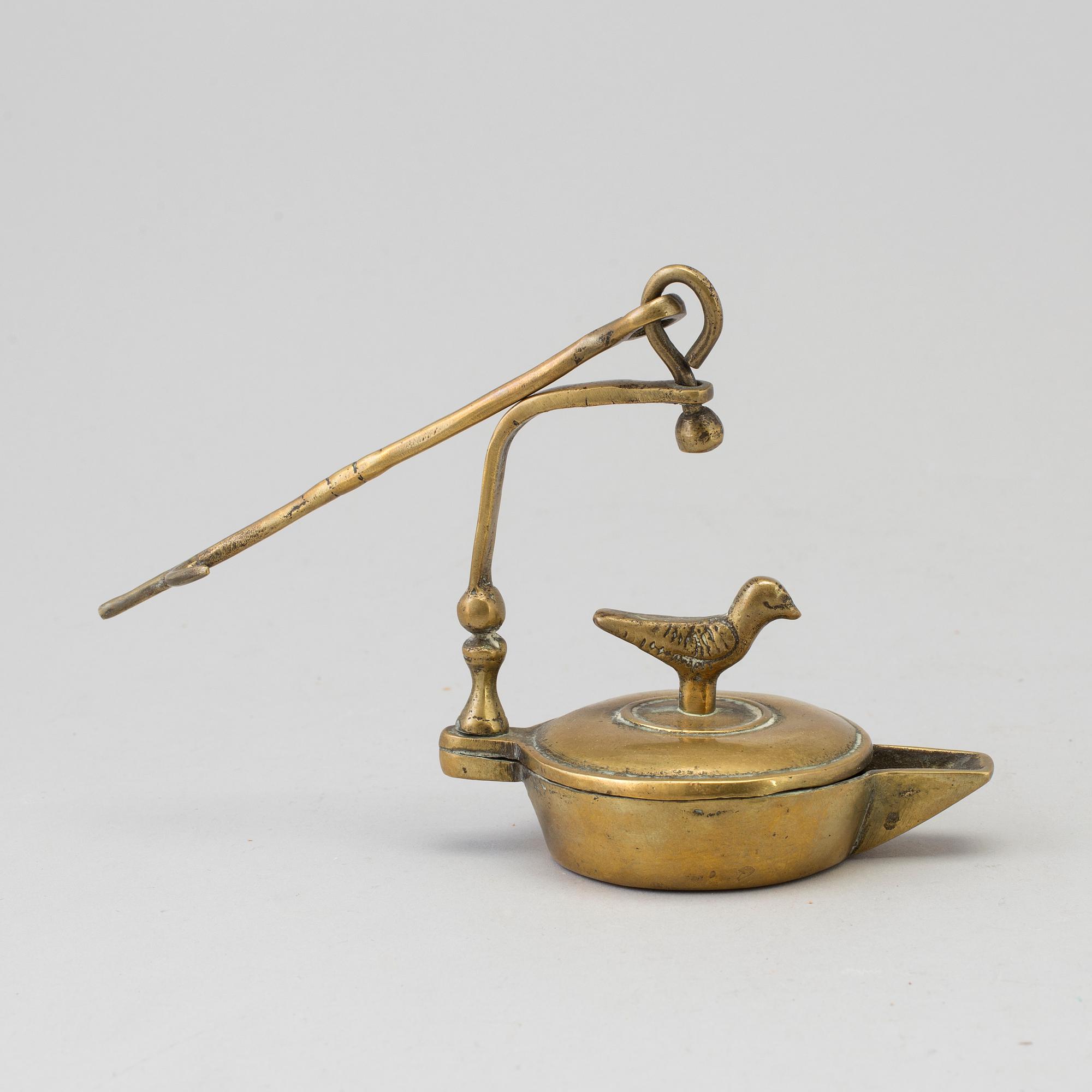 An 18th century bronze oil lamp.