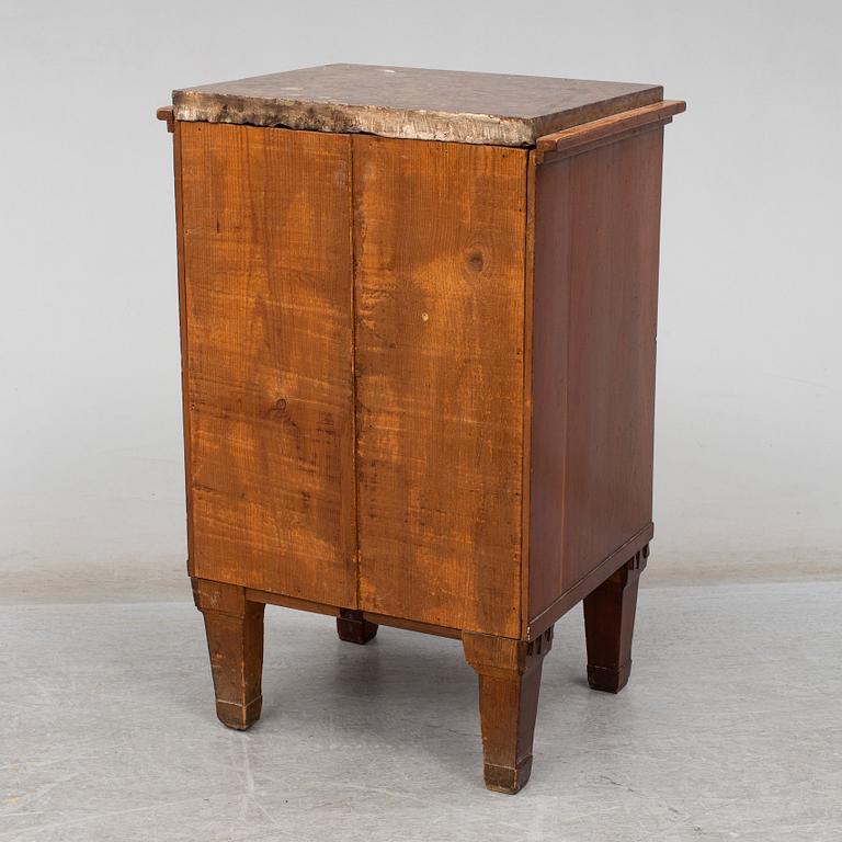 A mahogany veneered bedside table, 19th Century.