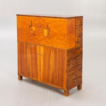 A 1930s birch bar cabinet.