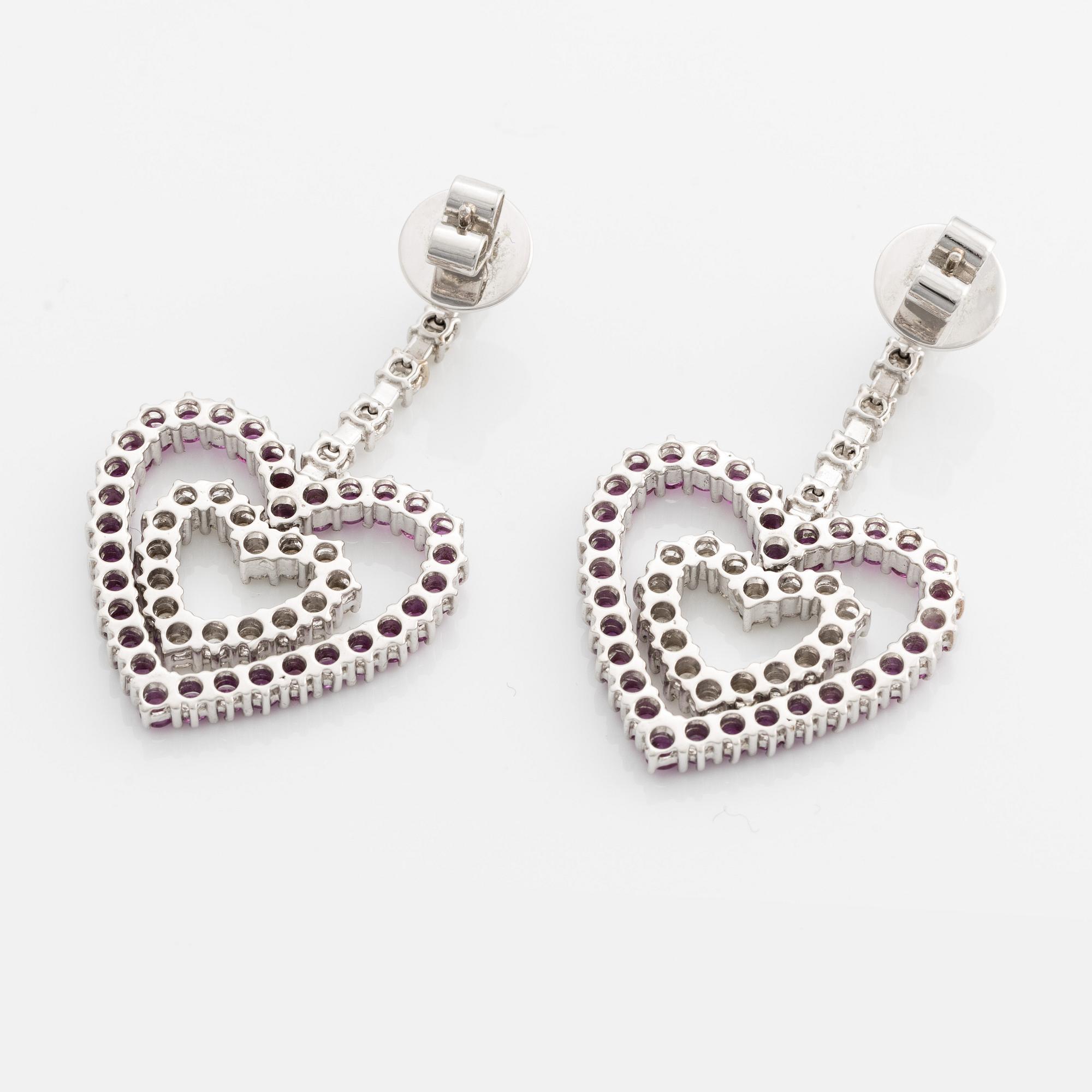 A pair of 18K gold earrings with round brilliant-cut diamonds and pink sapphires.