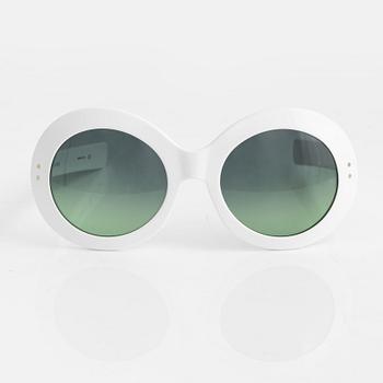 Oliver Goldsmith, a pair of white "Koko" sunglasses.