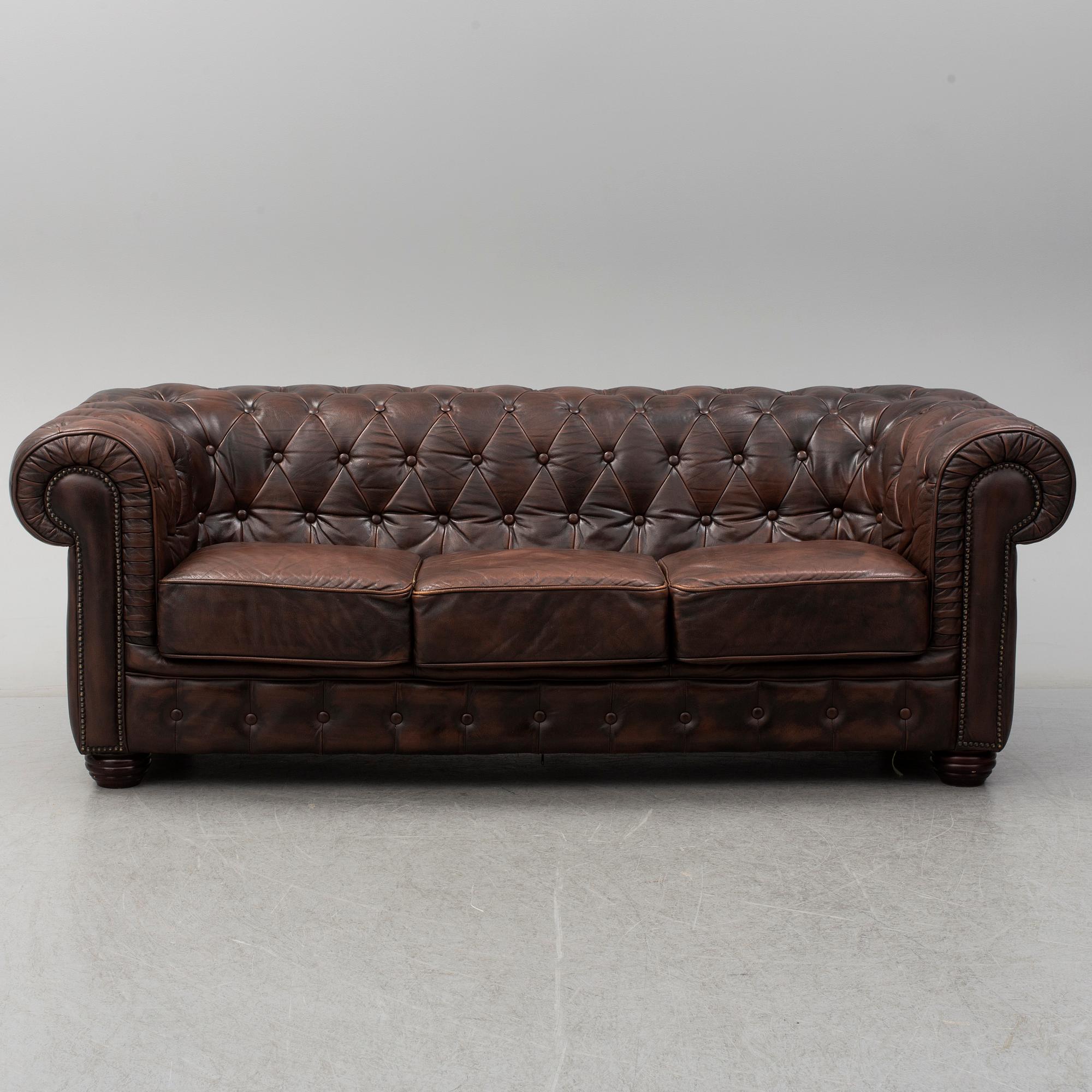 A 20th century leather upholstered Chesterfield sofa by Rubelli.