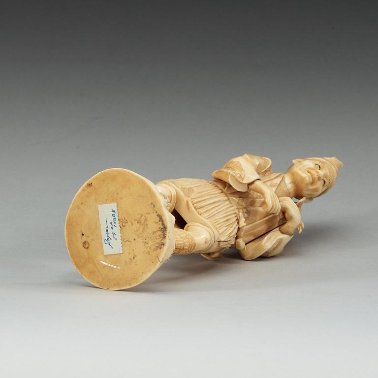 A Japanese ivory figure of a man, Meiji (1868-1912).