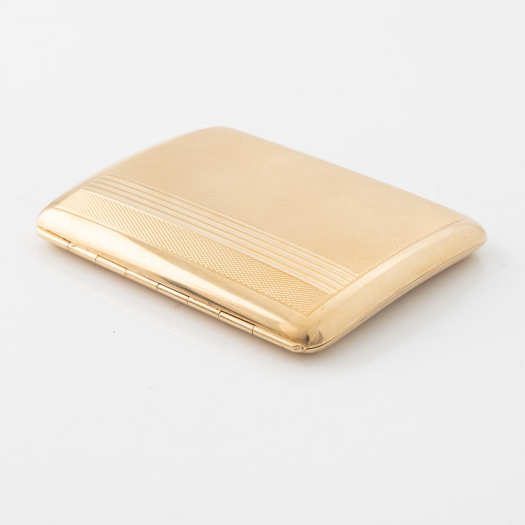 A 14 carat gold cigarette case.