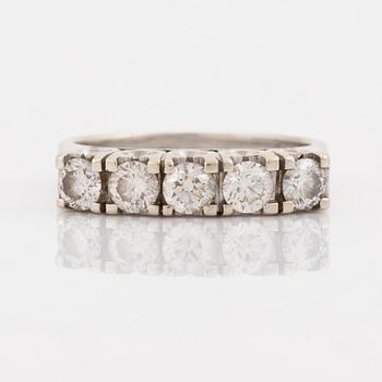 A 14K gold ring set with round brilliant-cut diamonds.