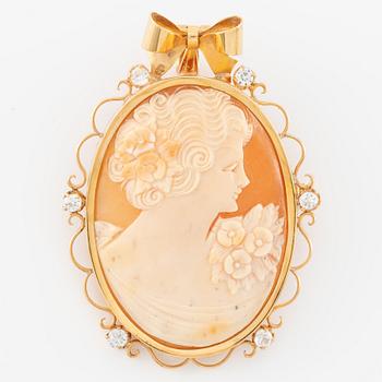 Pendant/brooch in 18K gold with shell cameo and white stones.