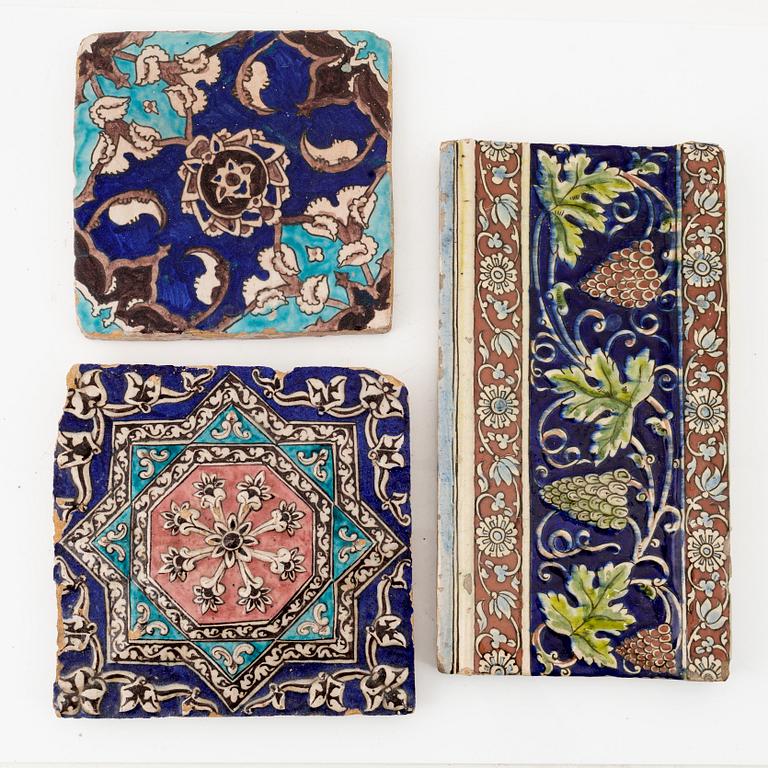 A group of three Persian (Iranian) tiles, glazed pottery, Qajar dynasty, 19th century.
