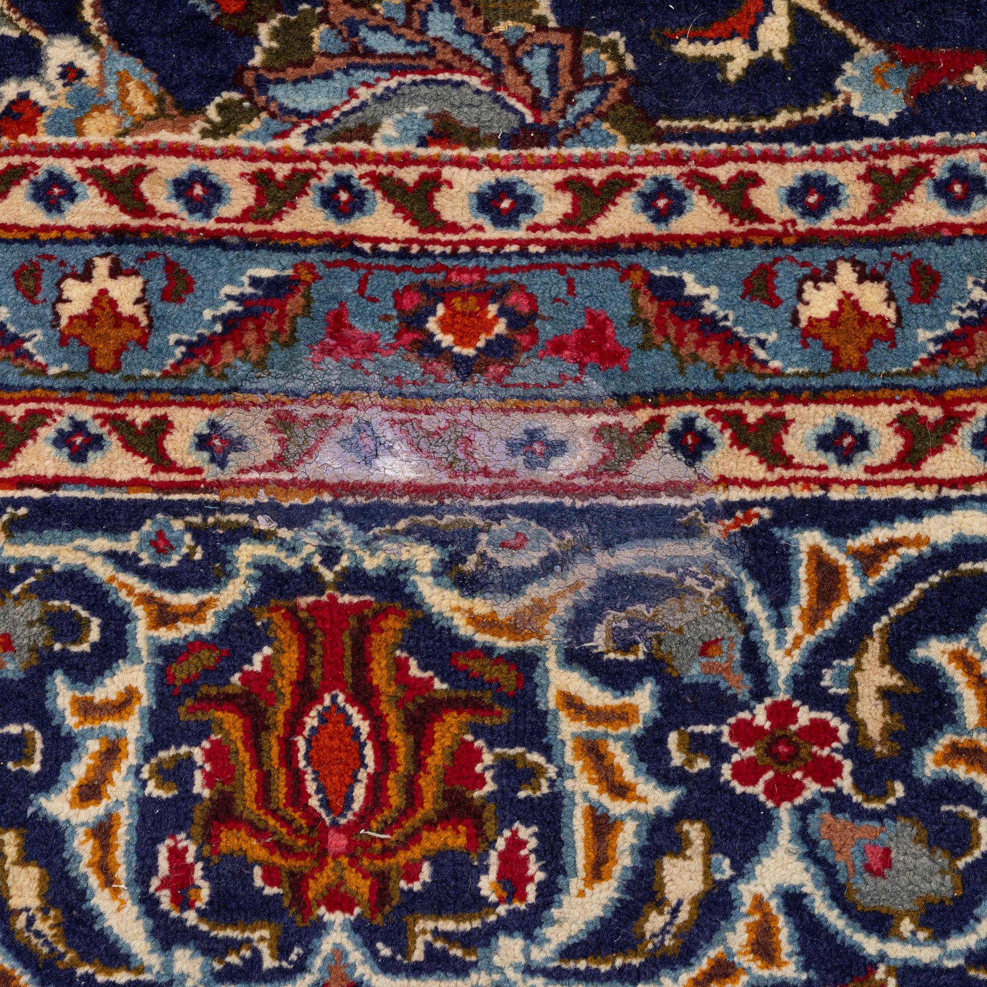 An oriental carpet, c. 390 x 295 cm.