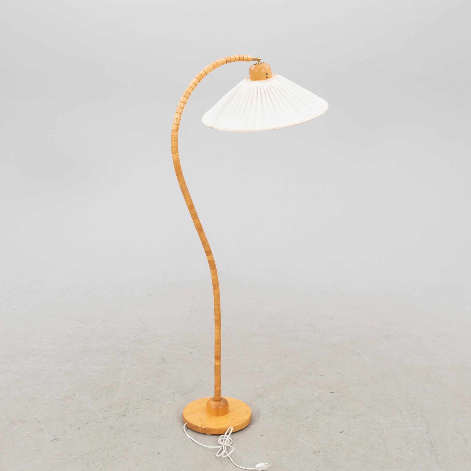 A Markslöjd 21st century wooden floor lamp.