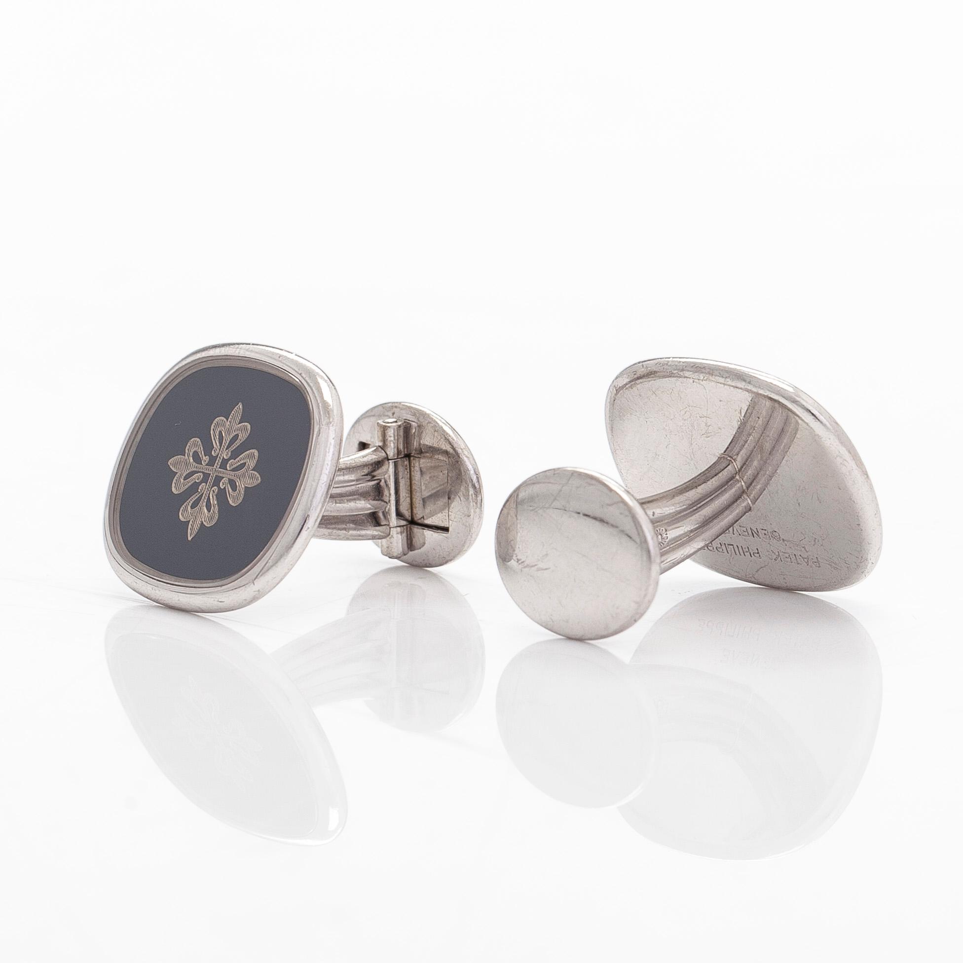 Patek Philippe, a pair of 18K whitegold 'Calatrava' cufflinks.