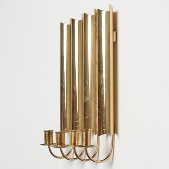A set of four 'Reflex' brass wall scones by Pierre Forsell, Skultuna.