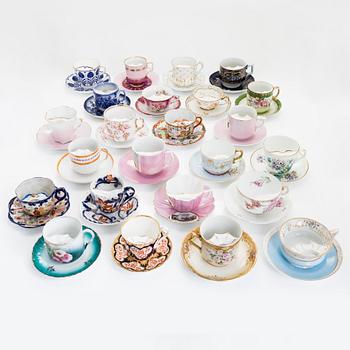 A set of 24 pair of porcelain mustache cups, including Germany, 19th and 20th century.