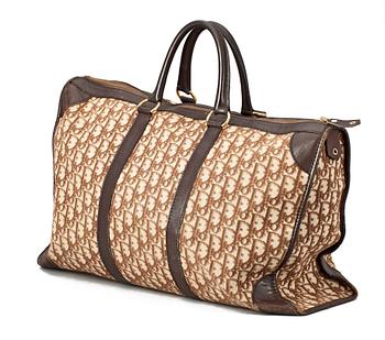 A monogram canvas weekendbag by Christian Dior.