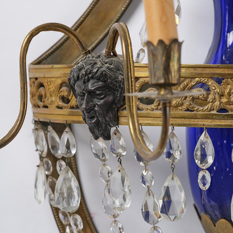 A pair of Russian Louis XVI-style  four-branch gilt bronze appliques, 19th century.