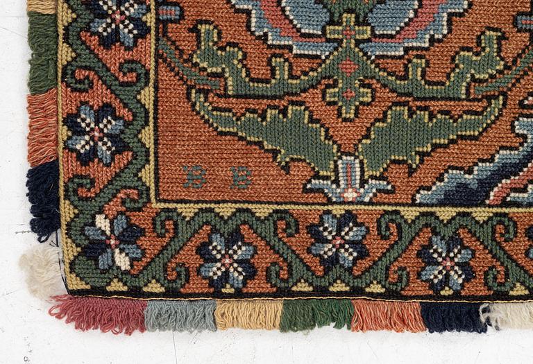 A sleigh cushion, signed BB and dated 1936, c. 160 x 67 cm.