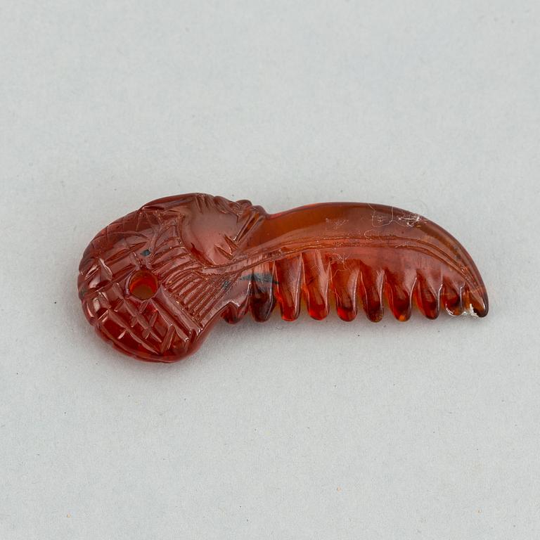 A group of amber objects, China, 20th Century. (14 small pieces).
