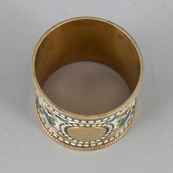 A Russian silver-gilt and cloisonné enamel napkin ring, unidentified makers mark, Moscow 1899-1908.