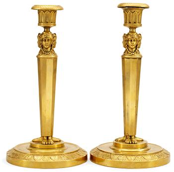 962. A pair of Empire candlesticks.