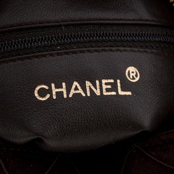 CHANEL, a brown suede cross body bag.